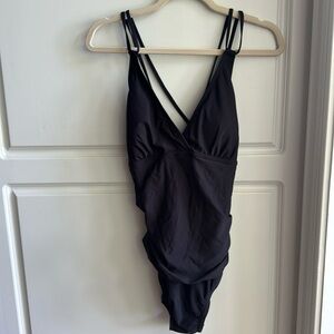 NWT black one piece bathing suit. Size XL light padding no underwire.